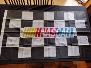 lot 111 image: 61 x 35 NASCAR flag with 26 signatures certification included