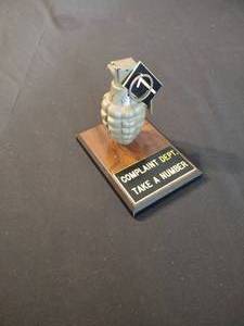 lot 123 image: Antique Grenade on plaque