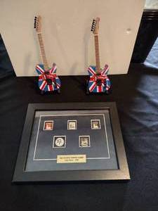 lot 122 image: Rolling Stones guitar and olympic pins