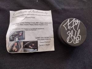 lot 129 image: Sydney Crosby Evgeni Malkin and Marc Andre Fleury black practice puck signed (certified)
