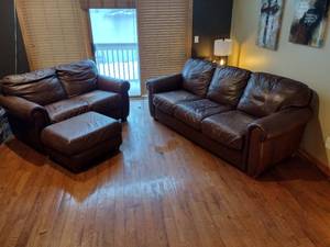 Brown leather couches with ottoman