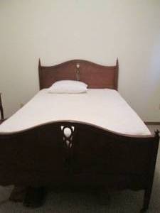 lot 30 image: Ornate bed with headboard and footb...