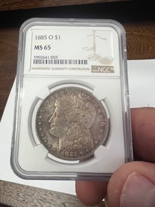 lot 8 image: 1885-O Morgan Silver Dollar MS-65 NGC