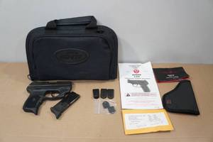 lot 22 image: Ruger LC9 9mm Semi-Auto Pistol - Laser Sight - 2 Magazines