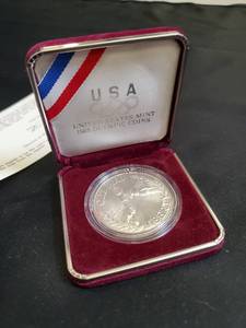 lot 20 image: 1983 USA Olympic Silver Coin with Certificate of Authenticity