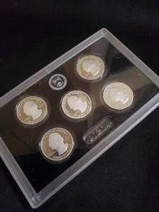 lot 51 image: Set of 5 State Quarters in Collectors Case