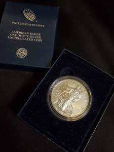 lot 64 image: American Eagle One Ounce Silver Uncirculated Coin with Original Box