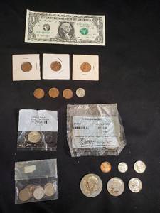 lot 77 image: Assorted Coin and Currency Collection Featuring Dollar Bill and Multiple Coin Sets