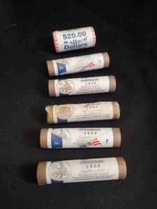 Collection of 2009 Lincoln Cents in Rolls and roll of 25 dollar coins