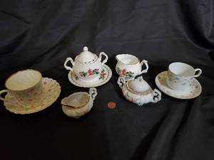 lot 115 image: Assorted Vintage Porcelain Tea Set with Christmas Theme and Floral Patterns