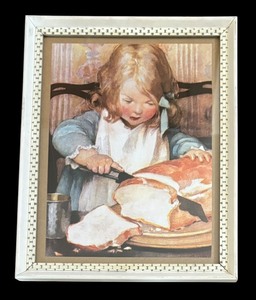 lot 73 image: Slicing Bread Framed Print by Jessie Wilcox Smith