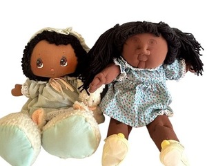 lot 99 image: Vintage 1983 Tootsie Lila African American 19 Cloth Doll W Bonnet & Bunny Slippers and Handmade Cabbage Patch Style Doll