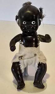 lot 290 image: Rare 1930s Black-Painted Baby Doll