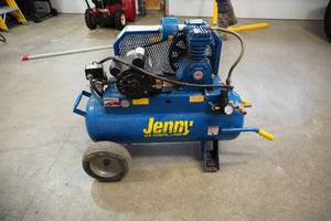 lot 7 image: Jenny Model AC15K15E17R Wheel Barrow Style Contractor Air Compressor