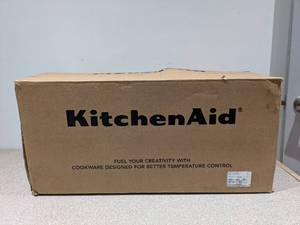 lot 57 image: BRAND NEW KITCHEN AID STAINLESS STEEL 3-PLY CLAD COOKWARE 12PC. SET