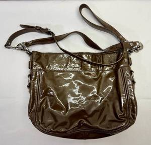 lot 17 image: Coach Zoe Liquid Patent Leather Convertible Bag-Brown