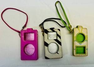 lot 22 image: Coach Signature IpodMP3 Case Wristlets