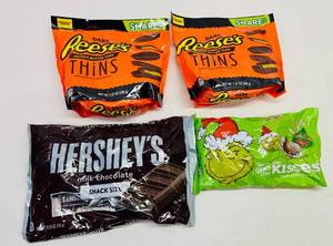 lot 59 image: 2 Reeces Dark Thins, Hersheys Snack Size Grinch Kisses