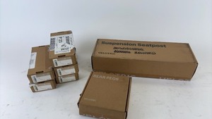 lot 696 image: Boxed Velotric Bicycle Accessories Collection - Seatpost, Rear Pegs, Mirrors