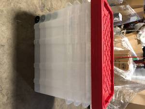 lot 32 image: Lot of HDX 77 Gal. Tough Storage Tote with Wheels in Clear with Red Lid  Customer Returns See Pictures