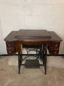 lot 352 image: Antique New Home Treadle Sewing Machine with Wrought Iron Frame