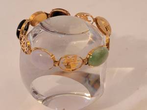 lot 111 image: 14K Gold Gemstone and Asian Cartouche Link Bracelet