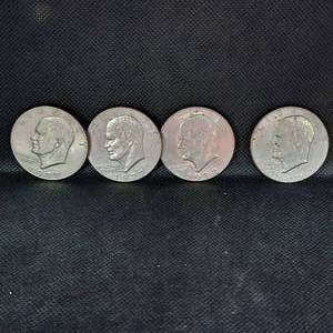 lot 12 image: 4-Ike silver Dollars, 1972,1977,1977,and 1976 Bicentennial