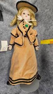 lot 71 image: Porcelain Doll, Dolls by Rene, Velvet Dress and Hat, Excellent Condition