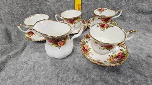 lot 77 image: Royal Albert Bone China, England, Country Rose Pattern-4 Tea CupsSaucers Creamer