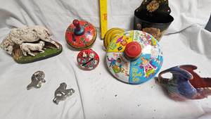 lot 14 image: Metal Tops, Parrot Creamer, Tin wall planter, sheep statue