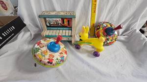 lot 42 image: Set of Vintage Metal Tops and Rabbit Toy