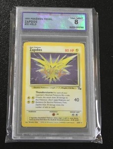 lot 15 image: 1999 Pokemon Fossil Holo Zapdos #1562