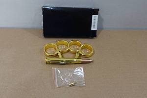 lot 27 image: Bullet Folding Knife Belt Buckle