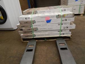 lot 12 image: TrafficMaster Grip Strip Teak Luxury Vinyl Plank Flooring
