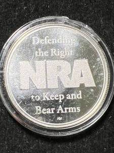 lot 28 image: 1 TROY OZ .999 FINE SILVER NRA ROUND IN AIRTITE