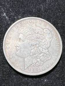lot 42 image: 1884-O US MORGAN SILVER DOLLAR