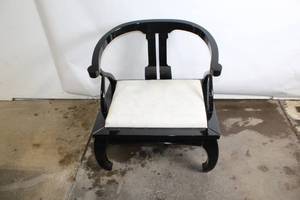 Elegant Black Armchair with Cream Cushion