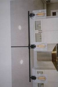 lot 123 image: Modern Black Linear Chandelier with Clear Glass Shades