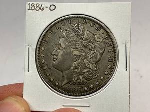 lot 32 image: 1886-O Morgan Silver Dollar