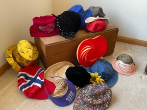 lot 45 image: Lets Tip Our Hat--Wooden chest with Fun Hats Inside
