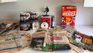 lot 6 image: 1991 Twins World Series Memorabilia from Jack Morris Statue, Decorative Mugs, Videos, Newspapers.  Lots of great treasures