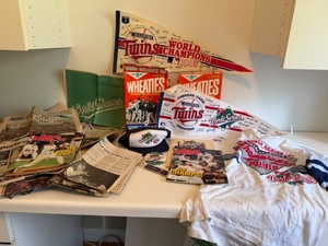 lot 7 image: 1987 World Series Championship Memorabilia including Hats, Pocket Schedule, Newspapers, Poster, etc.