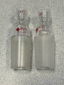 lot 76 image: 2 - 2942 Glass Adapters With #7 on Top Used