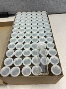 lot 99 image: 12 Gross Merco Shell Vials With Polyethylene Closures Twelve Dram 29x94mm