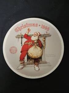 lot 38 image: Filling The Stockings -  Artist Norman Rockwell.  COA Included. Size 8 14