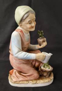 lot 107 image: Old Woman Gardener    Approx. 7 Tall