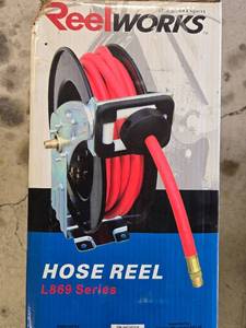 lot 123 image: ReelWorks 33ft Spring Driven Hose Reel L869 Series