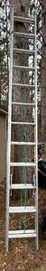 lot 129 image: Louisville Ladder L-2222-24 Type III 24 ft Aluminum Extension Ladder