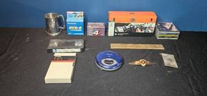 lot 209 image: Unique Collection of Mixed Media Items Including CDs, VHS, and More