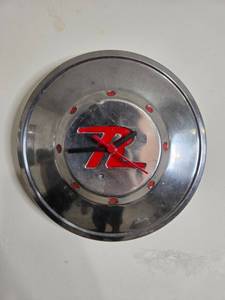 lot 304 image: Unique Metal Clock with Red R Logo